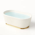 Vasca da bagno ovale in ceramica smaltata con base dorata